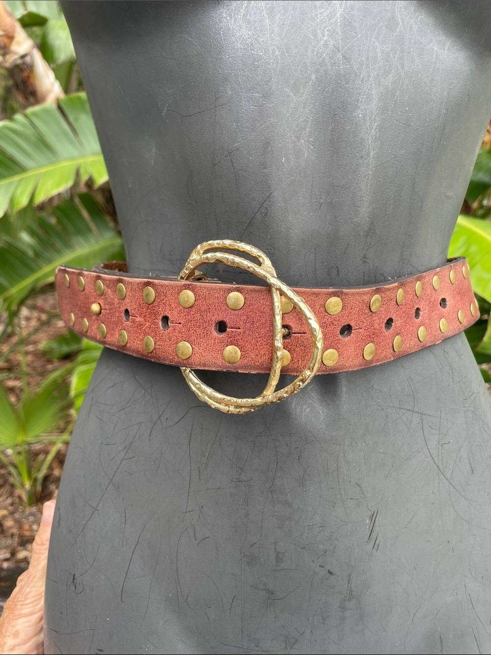 The free gold grommet studded belt with gold buckle